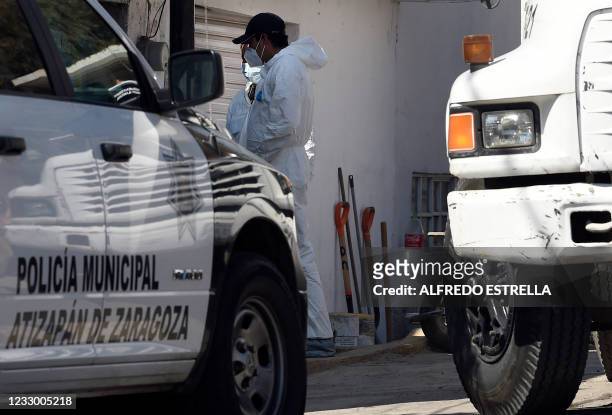 Forensic personnel enter the house of alleged serial killer Andres "N", who was detained a few days ago, in the municipality of Atizapan de Zaragoza,...