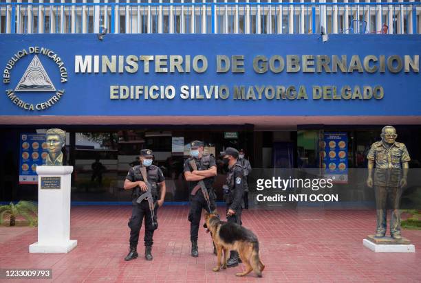 Members of the national police stand guard outside the Ministry of the Interior after Cristiana Chamorro, former director of the Violeta Barrios de...