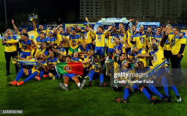 Estoril Praia players pose for a team photo with trophy after winning the Liga 2 Sabseg at the end of the Liga 2 Sabseg match between GD Estoril...