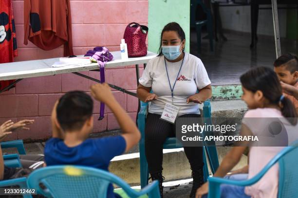 Doctors Without Borders volunteer plays games with children as part of a child mental health program amid the COVID-19 pandemic on May 20, 2021 in...