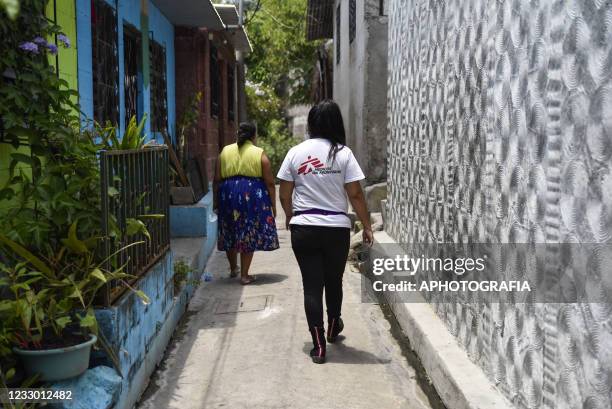 Doctors Without Borders volunteer walks through a community to perform social work on May 20, 2021 in San Salvador, El Salvador. Doctors Without...