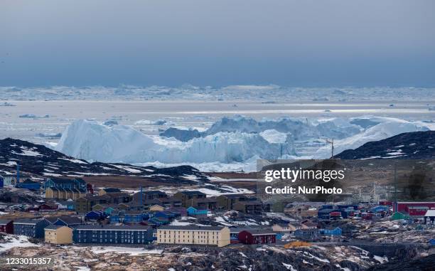 Icebergs near Ilulissat, Greenland. Climate change is having a profound effect in Greenland with glaciers and the Greenland ice cap retreating.