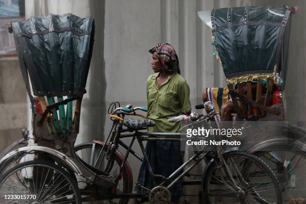Rickshaw puller waits for passenger amid lockdown in Dhaka, Bangladesh on May 18, 2021.