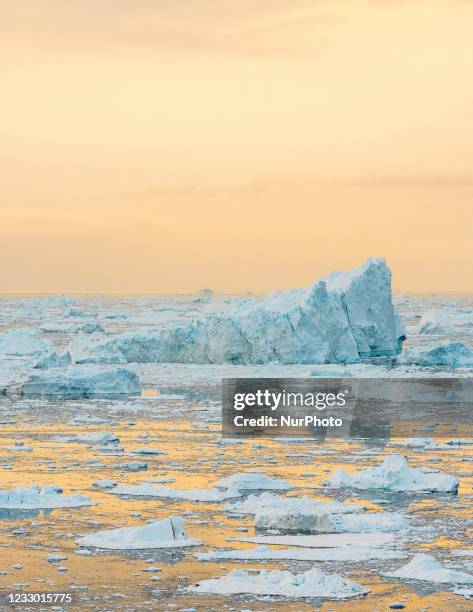 Icebergs near Ilulissat, Greenland. Climate change is having a profound effect in Greenland with glaciers and the Greenland ice cap retreating.