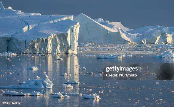 Icebergs near Ilulissat, Greenland. Climate change is having a profound effect in Greenland with glaciers and the Greenland ice cap retreating.