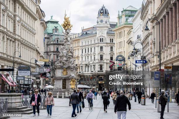 Pedestrians walk down the Graben shopping street in Vienna, Austria, on Thursday, May 20, 2021. Western Europe is beginning to loosen restrictions to...