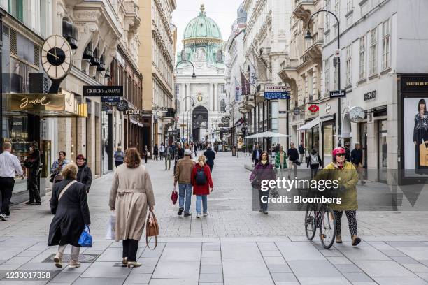 Pedestrians walk down the Kohlmarkt shopping street in Vienna, Austria, on Thursday, May 20, 2021. Western Europe is beginning to loosen restrictions...