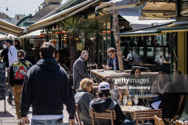 Customers on the outside area of a restaurant in the Naschmarkt in Vienna, Austria, on Thursday, May 20, 2021. Western Europe is beginning to loosen...