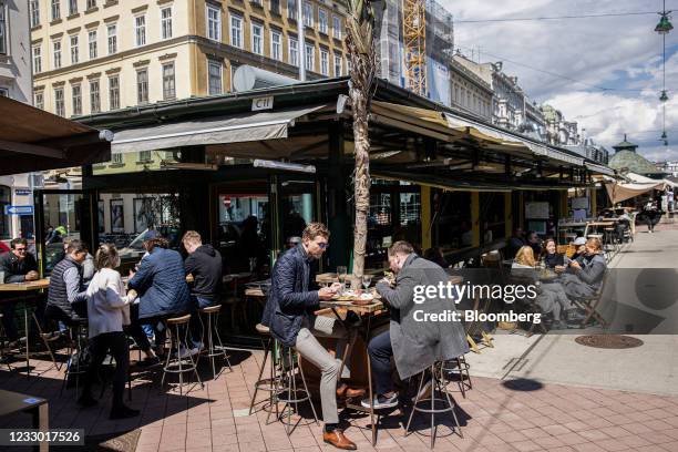 Customers dine at the outside area of a restaurant in the Naschmarkt in Vienna, Austria, on Thursday, May 20, 2021. Western Europe is beginning to...