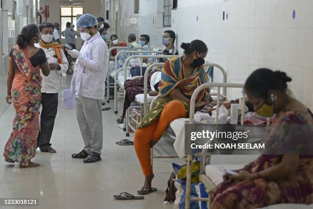 Doctor speaks to attendants of patients as he examines patients who recovered from Covid-19 coronavirus and now infected with Black Fungus, a deadly...