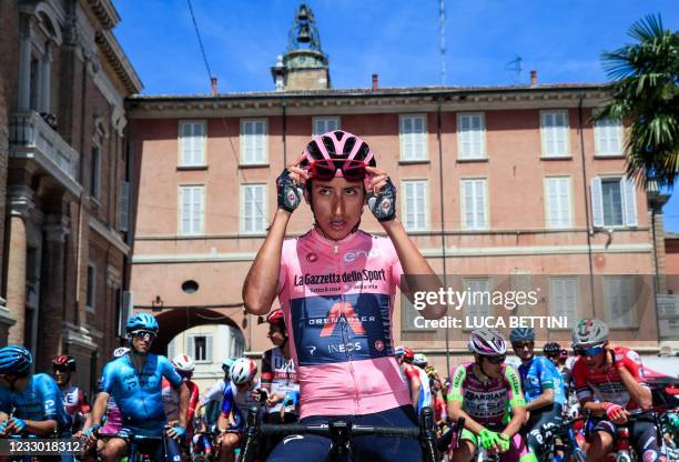 Team Ineos rider Colombia's Egan Bernal wearing the overall leader's pink jersey waits prior to the start of the 13th stage of the Giro d'Italia 2021...