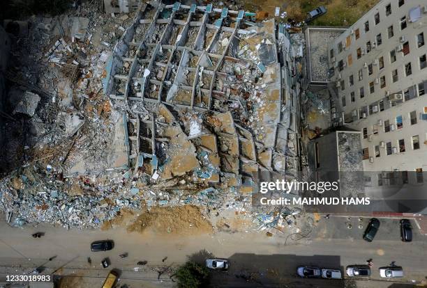 This aerial view taken on May 21 shows the Al-Jalaa Tower in Gaza City, that was levelled by an Israeli air strike during the recent military...