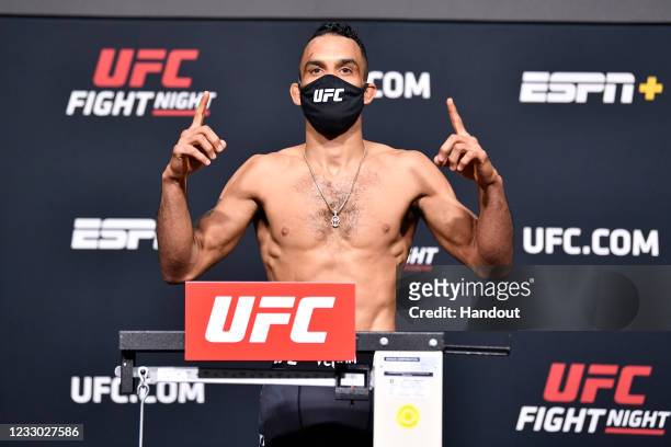 In this UFC handout, Rob Font poses on the scale during the UFC Fight Night weigh-in at UFC APEX on May 21, 2021 in Las Vegas, Nevada.