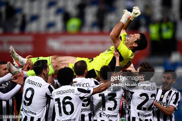 Gianluigi Buffon of Juventus FC is launched into the air by teammates during the award ceremony after the TIMVISION Cup final football match between...