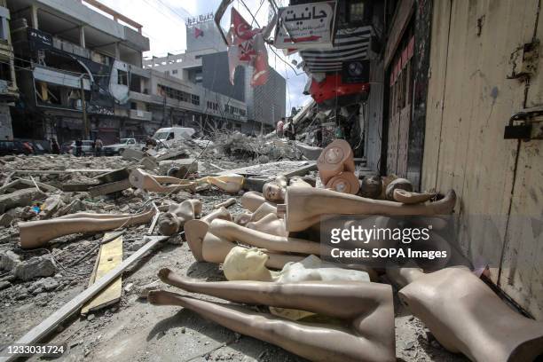 Parts of a broken mannequins lie on the ground near a tower building which was hit by Israeli air strikes, amid a flare-up of Israeli-Palestinian...