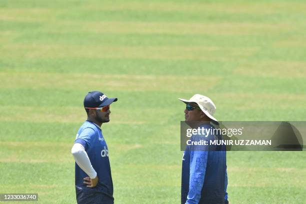 Bangladeshs Shakib Al Hasan speaks to team's head coach Russell Domingo during a practice session at the Sher-e-Bangla National Cricket Stadium in...