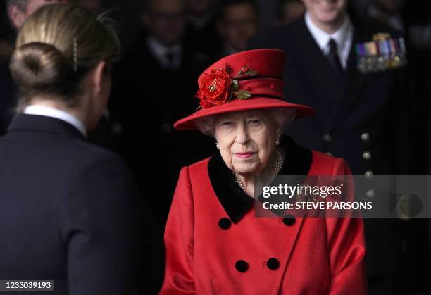 Britain's Queen Elizabeth II talks to military personnel during her visit to the aircraft carrier HMS Queen Elizabeth in Portsmouth, southern England...