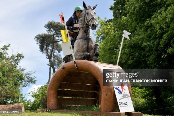 French's Nicolas Touzaint rides Diabolo Menthe, as he competes during the "Le Grand National du Lion d'Angers" - a preparatory event for the Tokyo...