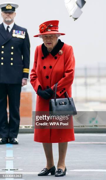 Queen Elizabeth II during a visit to HMS Queen Elizabeth at HM Naval Base ahead of the ship's maiden deployment on May 22, 2021 in Portsmouth,...