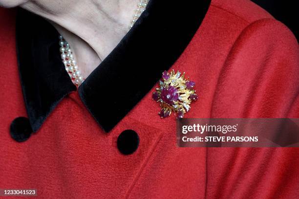 The brooch worn by Britain's Queen Elizabeth II during her visit to the aircraft carrier HMS Queen Elizabeth is pictured in Portsmouth, southern...