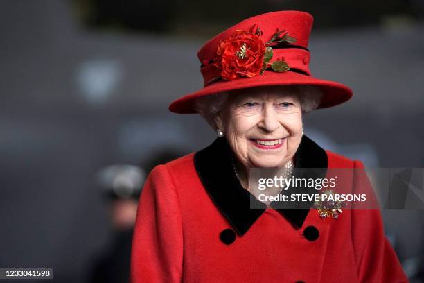 Britain's Queen Elizabeth II reacts during her visit to the aircraft carrier HMS Queen Elizabeth in Portsmouth, southern England on May 22 ahead of...