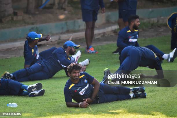 Sri Lanka's cricketers stretch during a training at the Sher-e-Bangla National Cricket Stadium in Dhaka in Dhaka in May 22, 2021 ahead of tomorrow's...