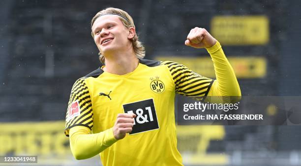 Dortmund's Norwegian forward Erling Braut Haaland celebrates the 1-0 during the German first division Bundesliga football match Borussia Dortmund vs...