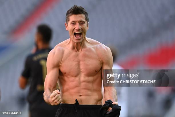 Bayern Munich's Polish forward Robert Lewandowski celebrates scoring his team's fifth goal and his 41st season goal during the German first division...