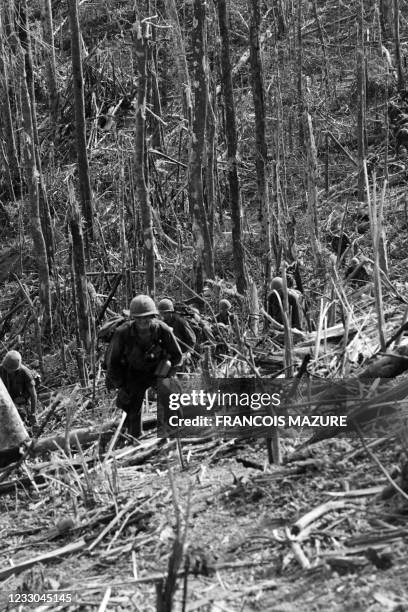 Soldiers leave the 875-meter-high hill after the battle, on November 24, 1967 in Dak To during the Vietnamese war.