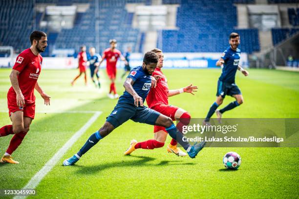 Ryan Sessegnon of Hoffenheim in action against Peter Pekarik of Berlin during the Bundesliga match between TSG Hoffenheim and Hertha BSC at...
