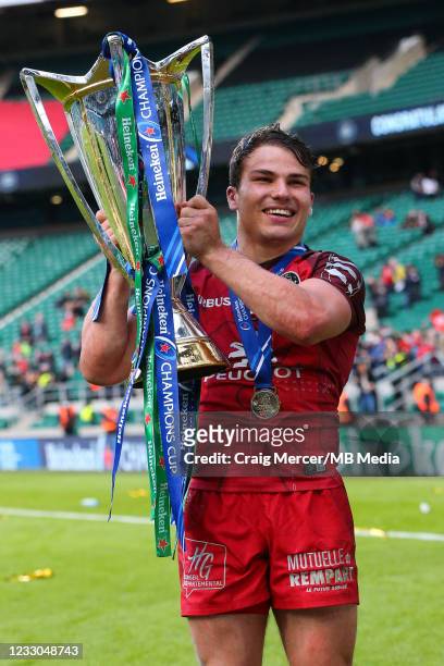 Antoine Dupont of Toulouse celebrates with the trophy after his sides victory during the Heineken Champions Cup Final between La Rochelle and...