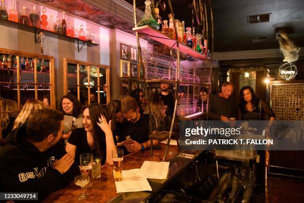Fully vaccinated customers gather at the bar inside Risky Business, that was once The Other Door but closed during the Covid-19 pandemic in the North...