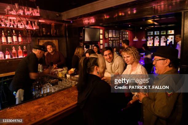 Fully vaccinated customers gather at the bar inside Risky Business, a private members-only club, that was once The Other Door but closed during the...