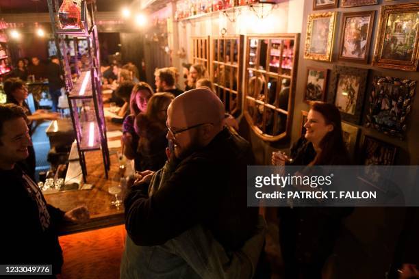 Fully vaccinated customers gather at the bar inside Risky Business, a private members-only club, that was once The Other Door but closed during the...