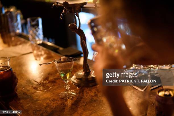 Customer takes a video of absinthe at the bar inside Risky Business, a private members-only club, that was once The Other Door but closed during the...