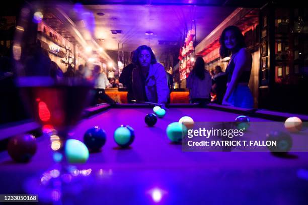 Fully vaccinated customers play pool inside Risky Business, a private members-only club, that was once The Other Door but closed during the Covid-19...