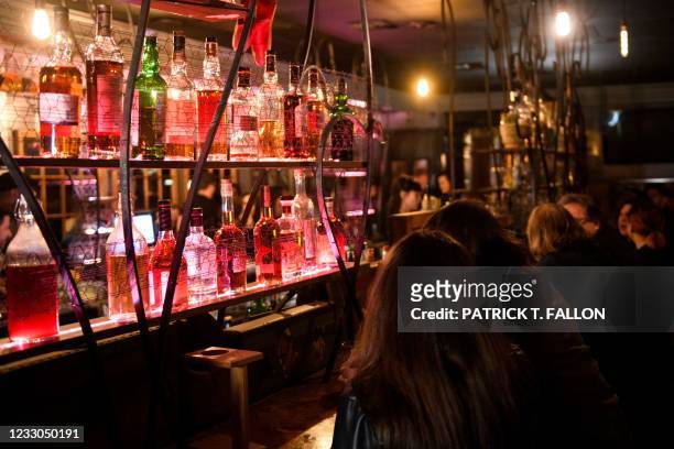Fully vaccinated customers gather at the bar inside Risky Business, that was once The Other Door but closed during the Covid-19 pandemic in the North...