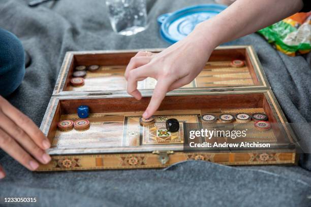 Residents of Napier Barracks playing backgammon with someone as 200 campaigners from different local groups came together today for a festival of...