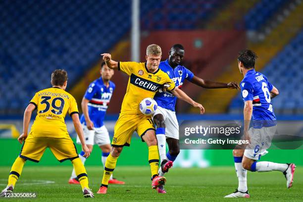 Andreas Cornelius of Parma and Omar Colley of Sampdoria vie for the ball during the Serie A match between UC Sampdoria and Parma Calcio at Stadio...