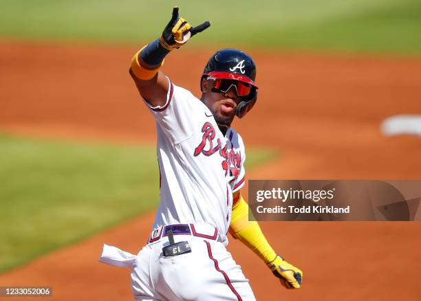 Ronald Acuna Jr. #13 of the Atlanta Braves reacts after hitting a lead-off home run in the first inning of an MLB game against the Pittsburgh Pirates...