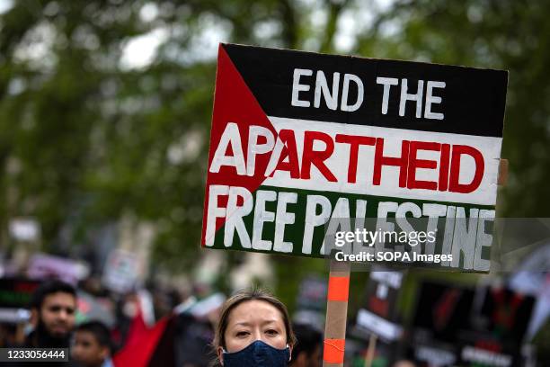 Protester holds a placard during the demonstration. Demonstrators came out in support of Palestinians and in opposition to recent Israeli...