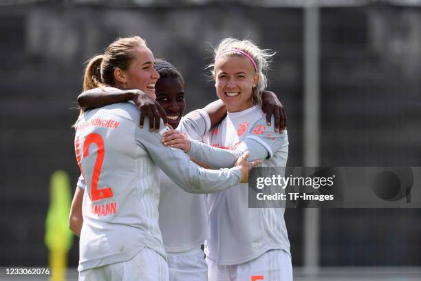 Carina Wenninger of Bayern Muenchen with Sydney Lohmann of Bayern Muenchen and Hanna Glas of Bayern Muenchen celebrates after scoring his team's...