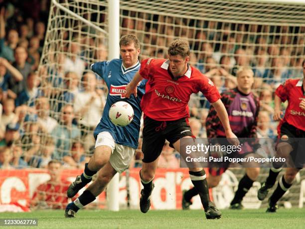 Ian Marshall of Leicester City and Gary Pallister of Manchester United compete for the ball during an FA Carling Premiership match at Filbert Street...