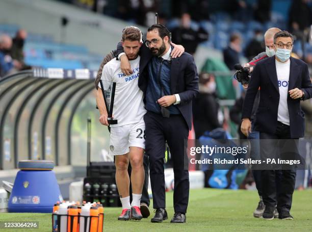 Leeds United's Gaetano Berardi in a T-Shirt thanking team-mate Pablo Hernandez with director Victor Orta before the Premier League match at Elland...