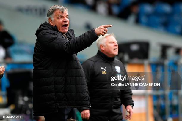 West Bromwich Albion's English head coach Sam Allardyce and West Bromwich Albion's assistant head coach Sammy Lee gesture on the touchline during the...