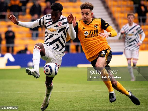 Anthony Elanga of Manchester United competes with Rayan Ait Nouri of Wolverhampton Wanderers during the Premier League match between Wolverhampton...