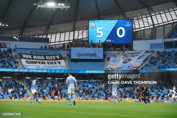 The electronic board shows the score at 5-0 during the English Premier League football match between Manchester City and Everton at the Etihad...