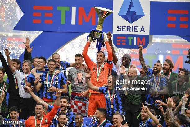 Goalkeeper Samir Handanovic, captain of FC Internazionale holds up the Scudetto trophy won by the Nerazzurri with four rounds in advance, at the end...