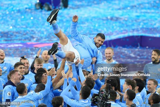 Manchester City players throw Sergio Aguero in the air after the Premier League match between Manchester City and Everton at Etihad Stadium on May...