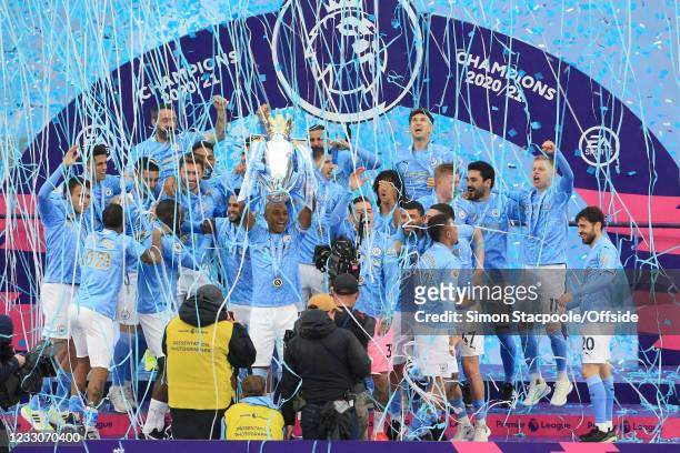 Fernandinho of Manchester City lifts the trophy as Manchester City celebrate their title victory after the Premier League match between Manchester...